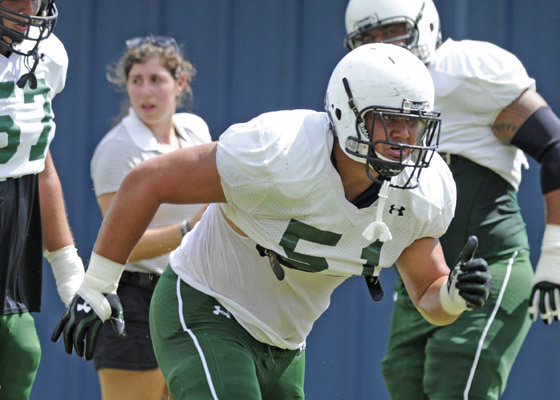 Hawaii OL John Wa'a ran through a drill during practice on Aug. 11. (Bruce Asato / basato@staradvertiser.com)