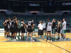 Rainbow Wahine coach Laura Beeman spoke with her players after the first full practice of the 2014-15 preseason.