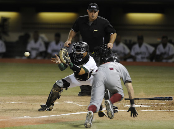 Freshman Chayce Ka'aua has added an improved offensive game to his already stout defense behind the plate for Hawaii. Photo by Bruce Asato/Star-Advertiser.
