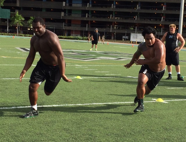 Right tackle R.J. Hollis and nose tackle Penitito Faalologo