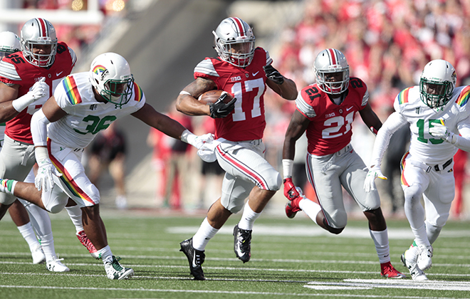 Ohio State running back Jalin Marshall got past Hawaii linebacker Benny Fonua in the first half Saturday.