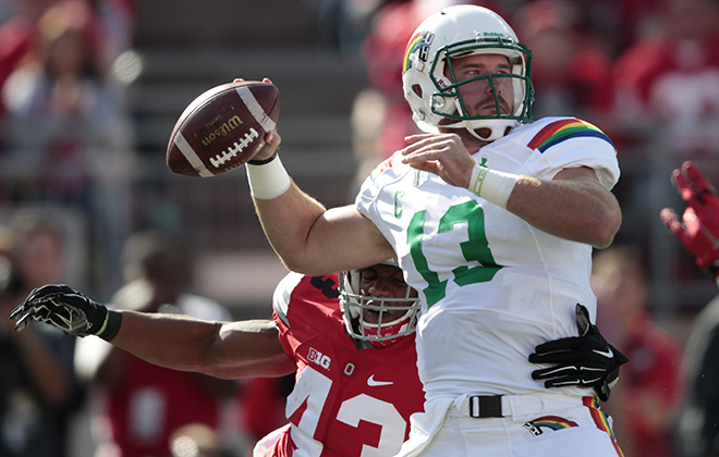 Hawaii quarterback Max Wittek threw under pressure from Ohio State linebacker Darron Lee in the first half Saturday at Ohio Stadium.