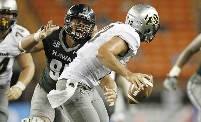 UH defensive lineman Kennedy Tulimasealii applied the pressure to Colorado quarterback Sefo Liufau. (George F. Lee / glee@staradvertiser.com)