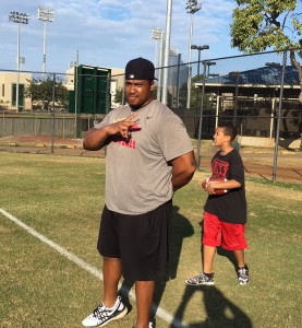 Kynan Forney, a former UH offensive lineman who played 10 NFL seasons, and son Vincent (who was named after former Warrior Vince Manuwai)