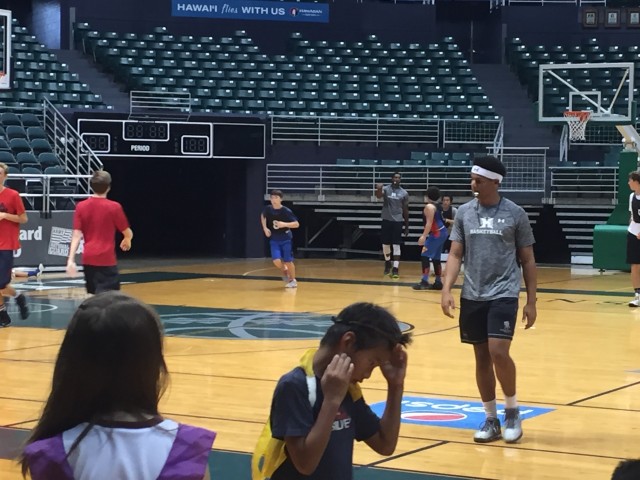 Drew Buggs (foreground) and Daryl Matthews (background) officiated a scrimmage.
