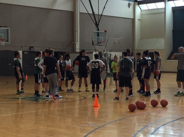 Laura Beeman addresses the Rainbow Wahine on Sunday during the team's opening practice of the 2016-17 season.