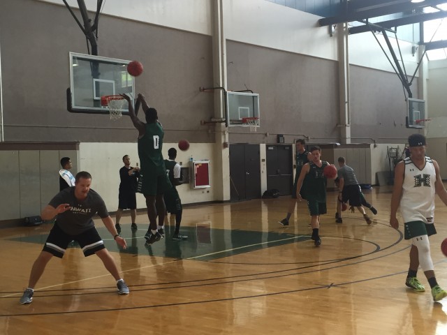 Assistant coach Adam Jacobsen put the guards through a dribble pull-up drill.