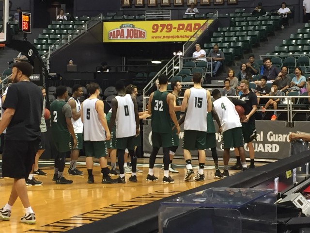 The current Bows made a tunnel for the alumni. Certain alums, like graduate manager Zane Johnson, had to fight their way through.