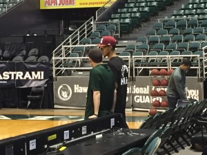 Eran Ganot and Negus Webster-Chan exchanged pleasantries during UH basketball practice.