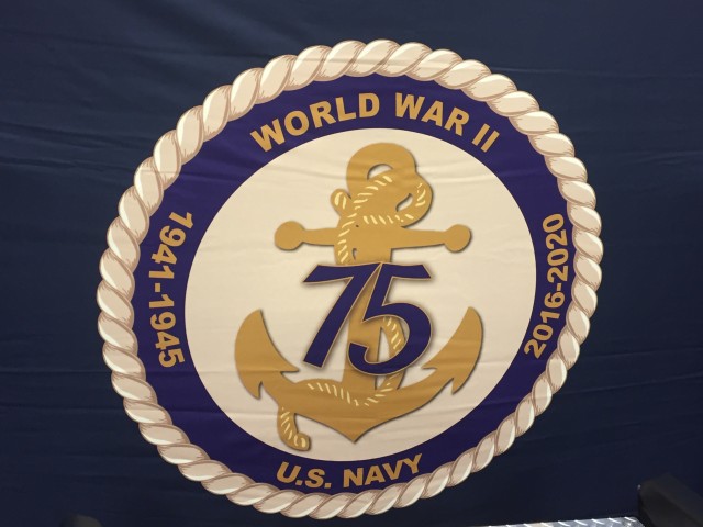 These large Pearl Harbor anniversary insignias appear all over the arena interior. 