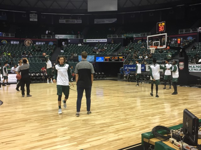 The Rainbow Warriors warmed up on the Armed Forces Classic court for their game against SIU-Edwardsville.