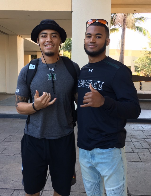 Quarterback Ikaika Woolsey and former UH defensive back John Hardy-Tuliau 