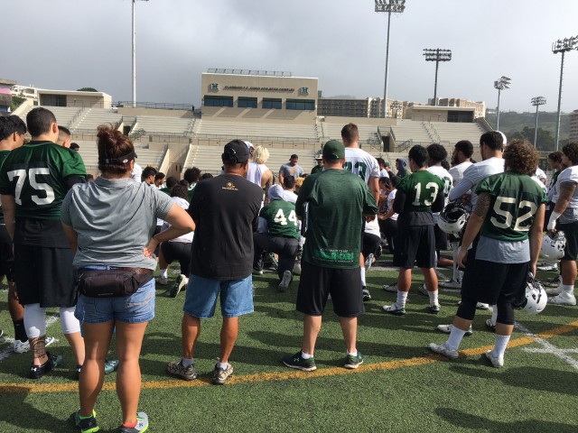 Chris Brown speaks to the team after today's practice