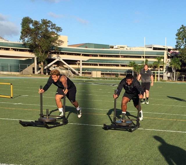 Kingjames Taylor and defensive lineman Joey Nuuanu-Kuhiiki