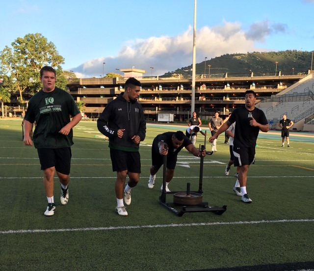 Offensive lineman Austin Webb, defensive end Meffy Koloamatangi, defensive tackle Kiko Faalologo and d-end Jamie Tago