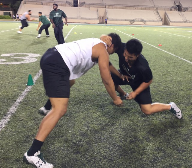 Defensive end Pumba Williams and H-back Dayton Furuta