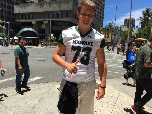 Offensive lineman Austin Webb flashes a shaka — and his Hawaii Bowl ring 